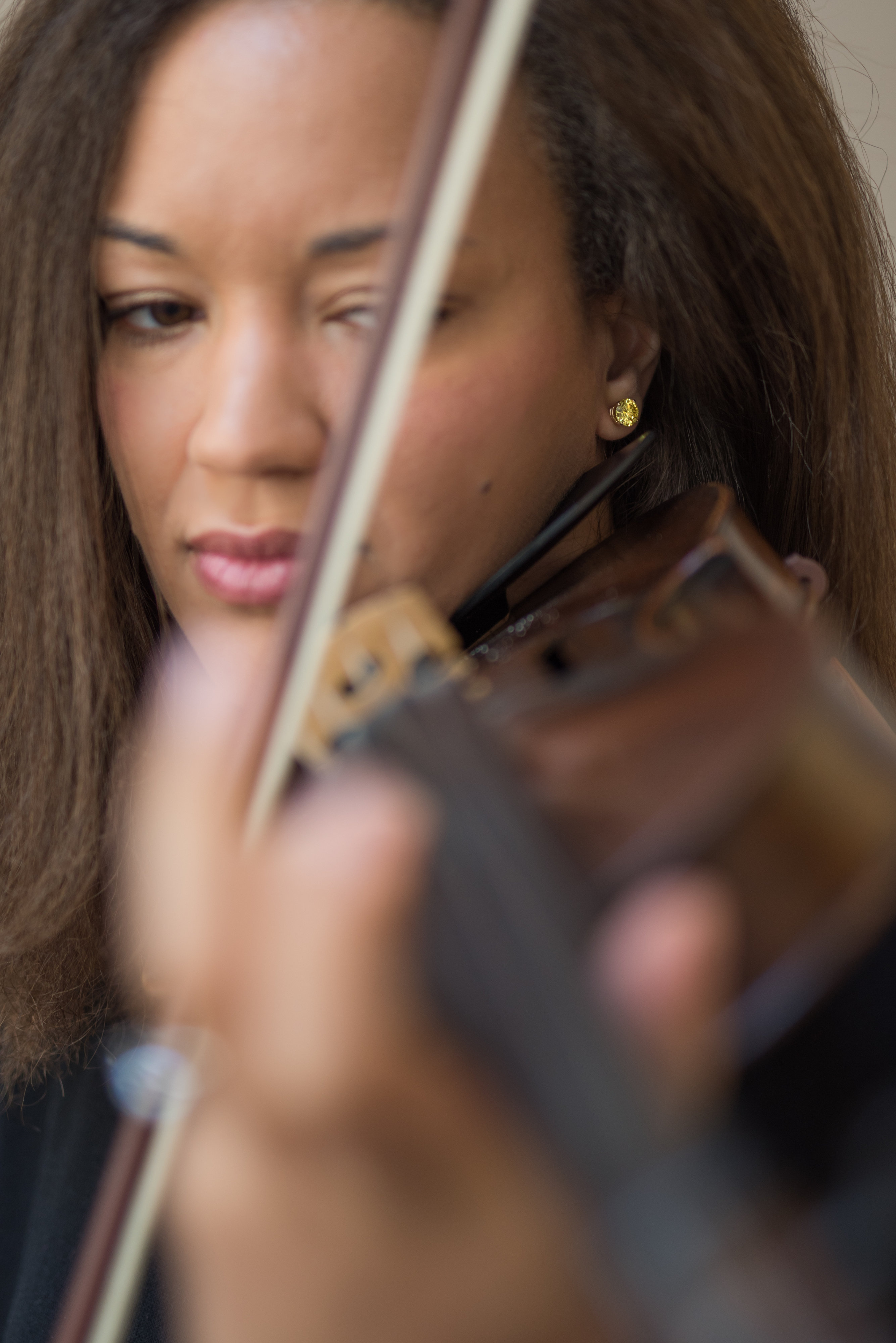 Angelene Boto plays a violin.