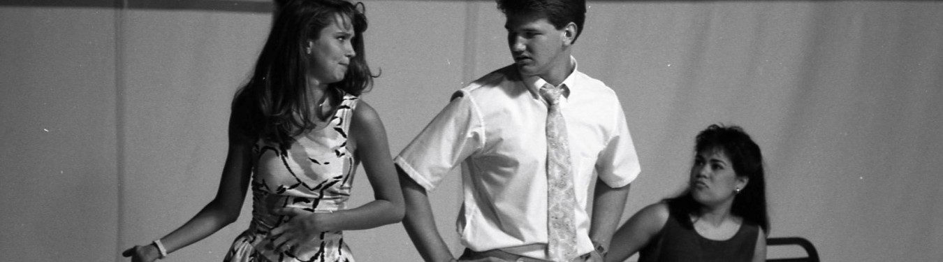 Black and white image of Laura Galt and another student acting. 